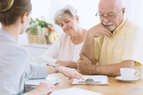 older couple looking at paperwork - difference between DNR and living will